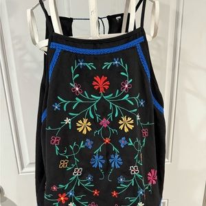 An open blouse strings across